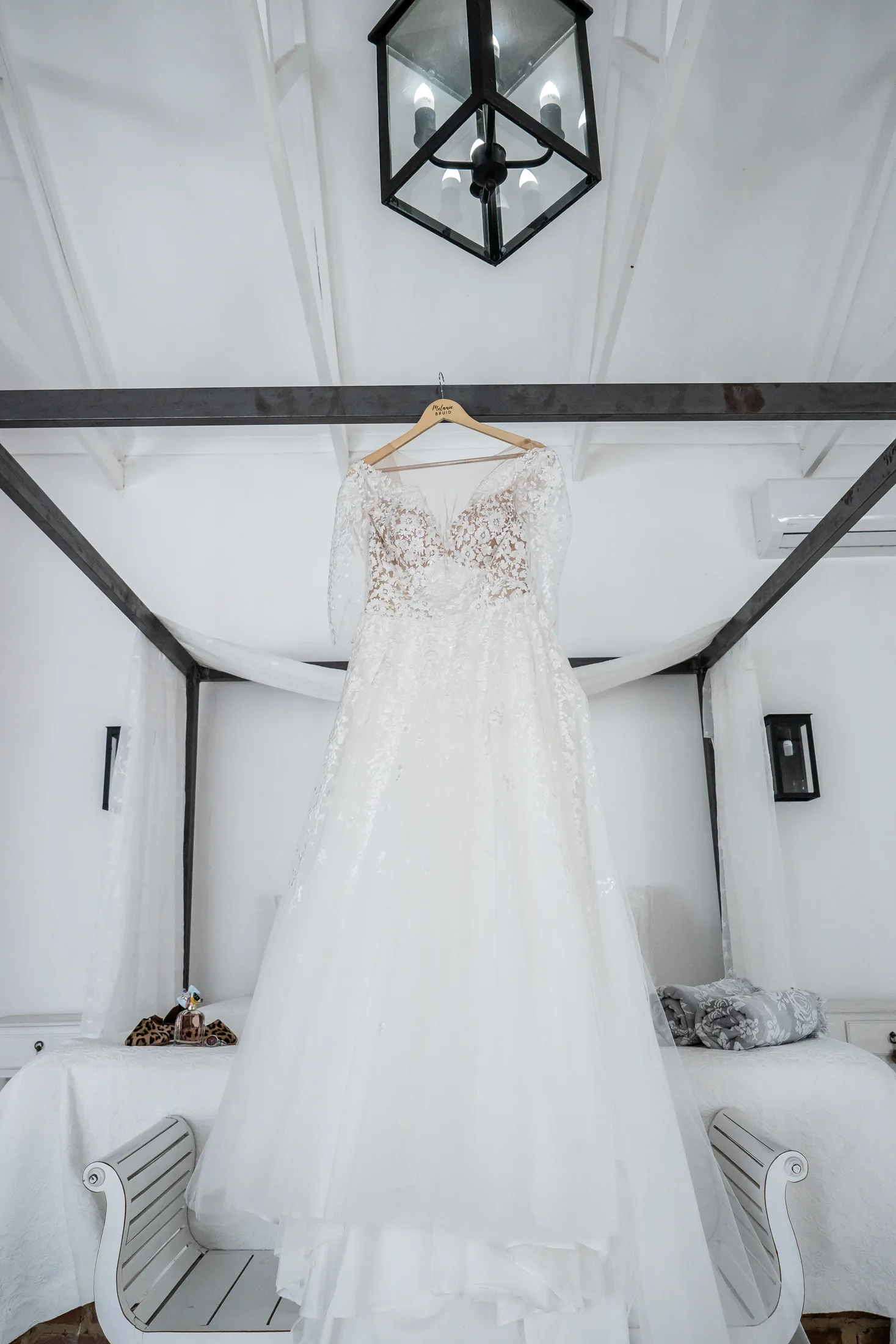 Melanie’s wedding dress hanging before she gets ready