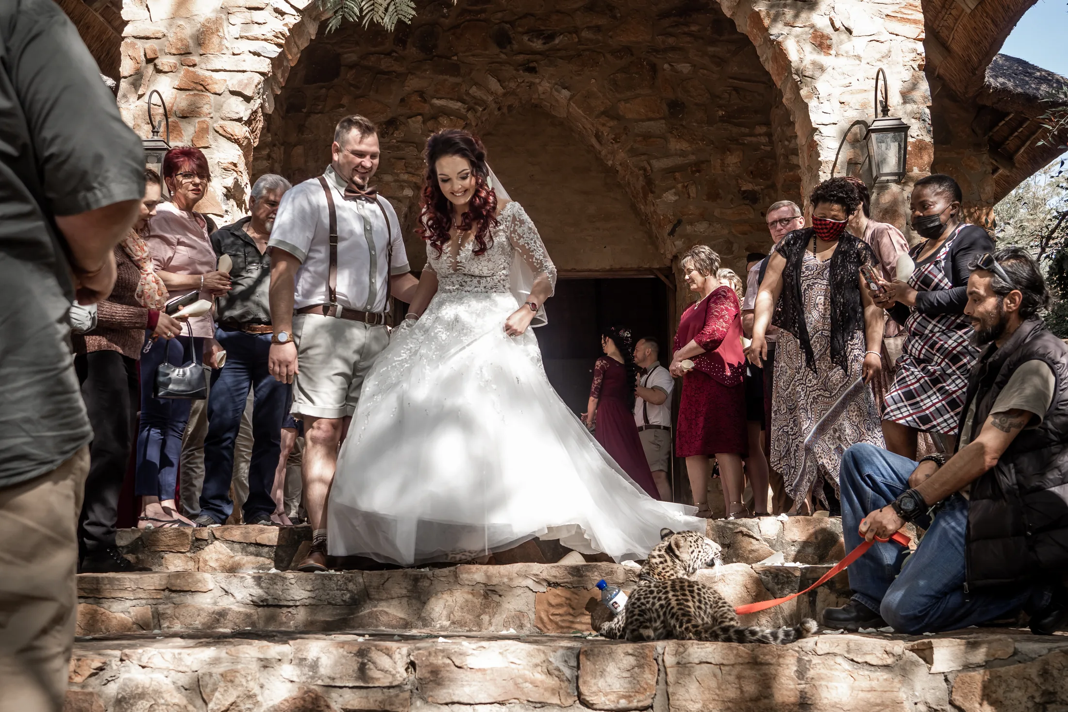 Armand and Melanie leaving the chapel through confetti