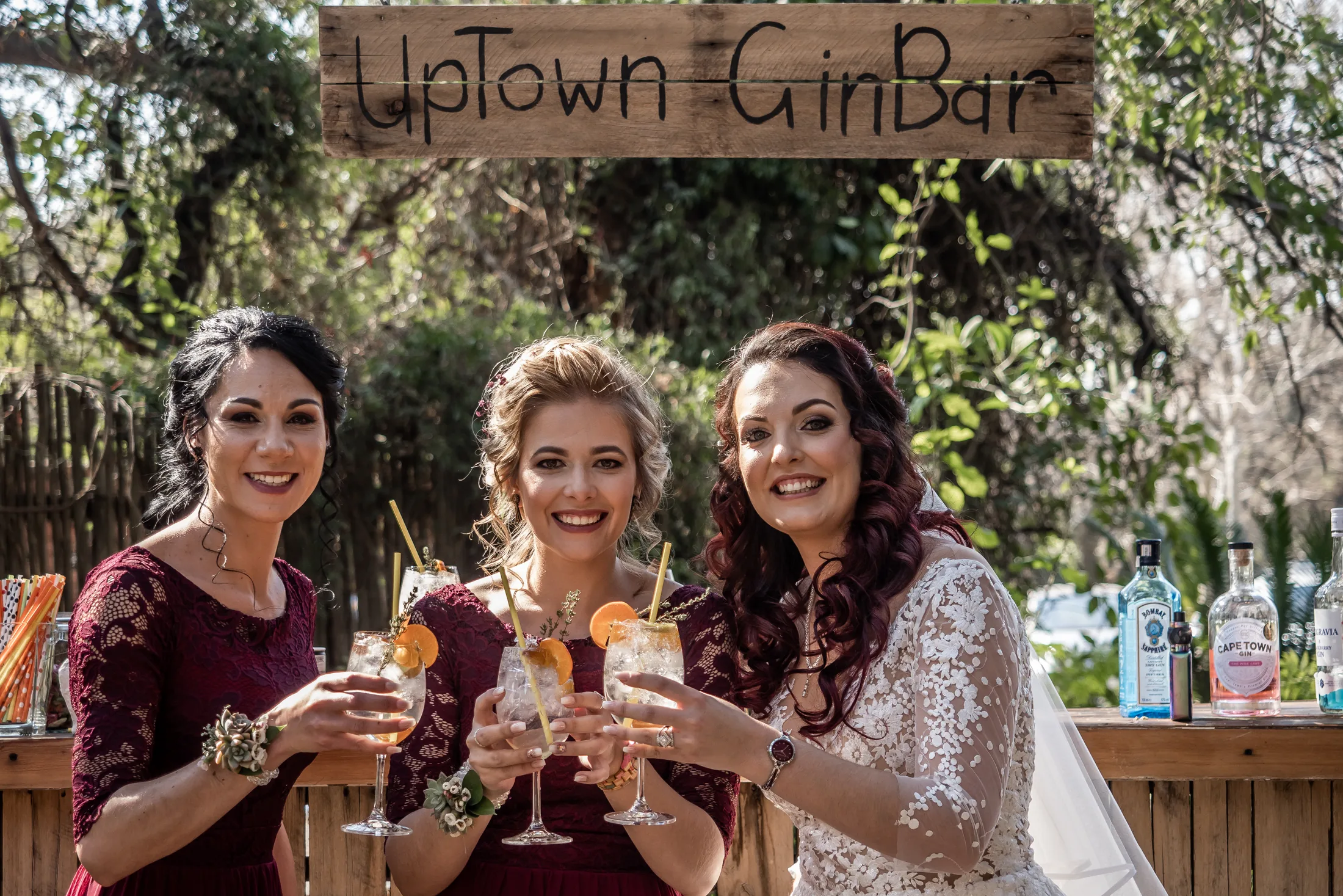 Melanie and her bridesmaids sharing a toast outside