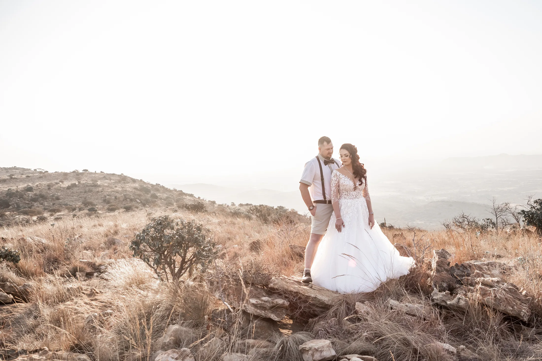 Armand and Melanie walking through the open landscape