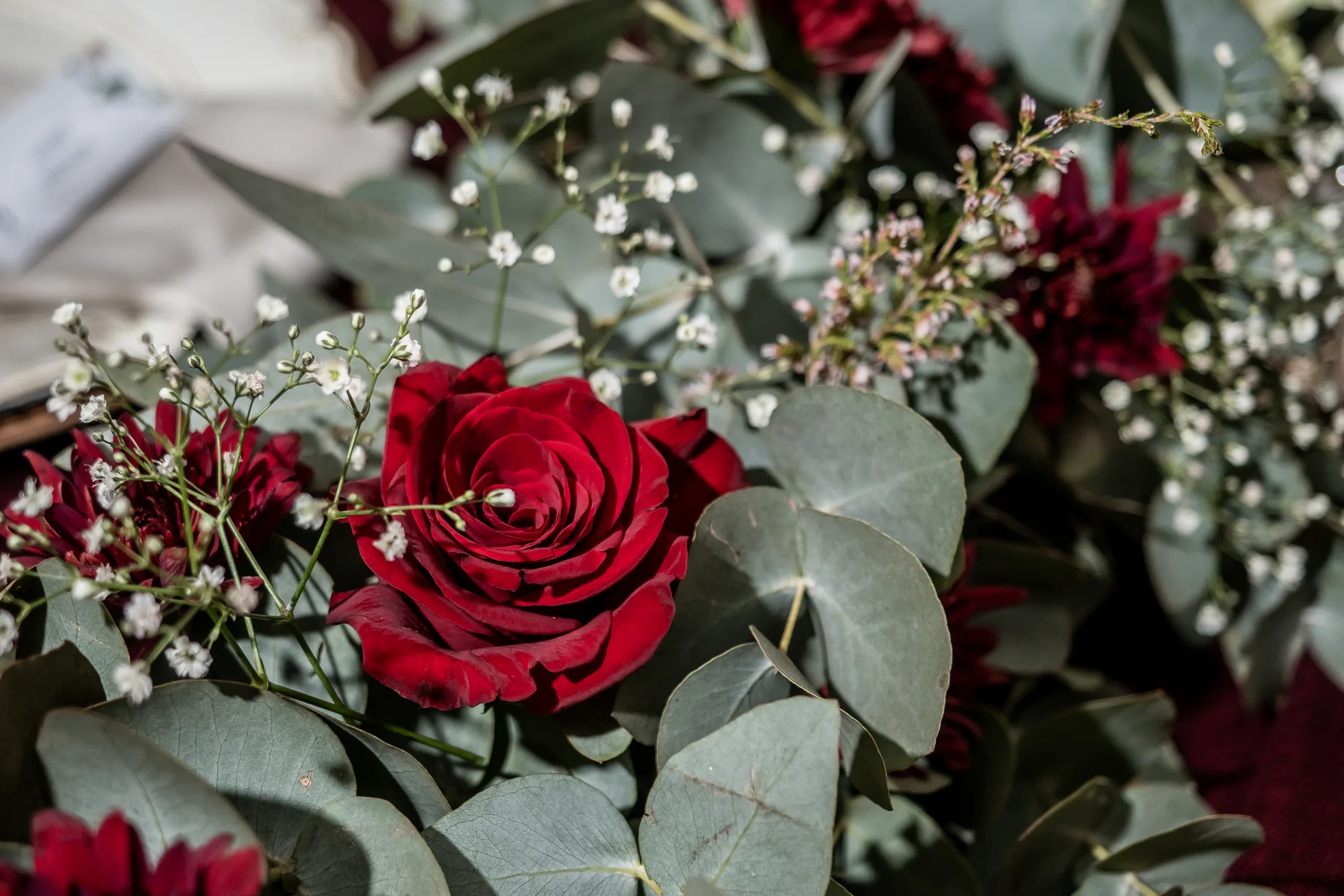 Burgundy and blush wedding flowers at Lavandou