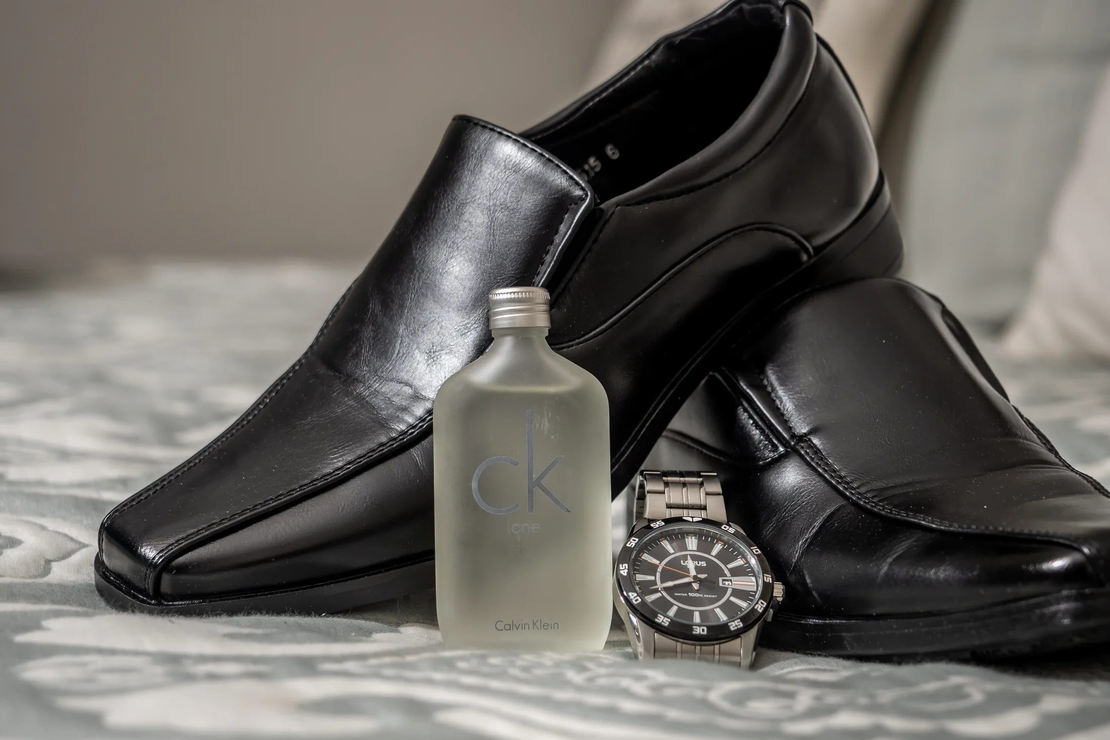 Groom’s shoes, watch and wedding details