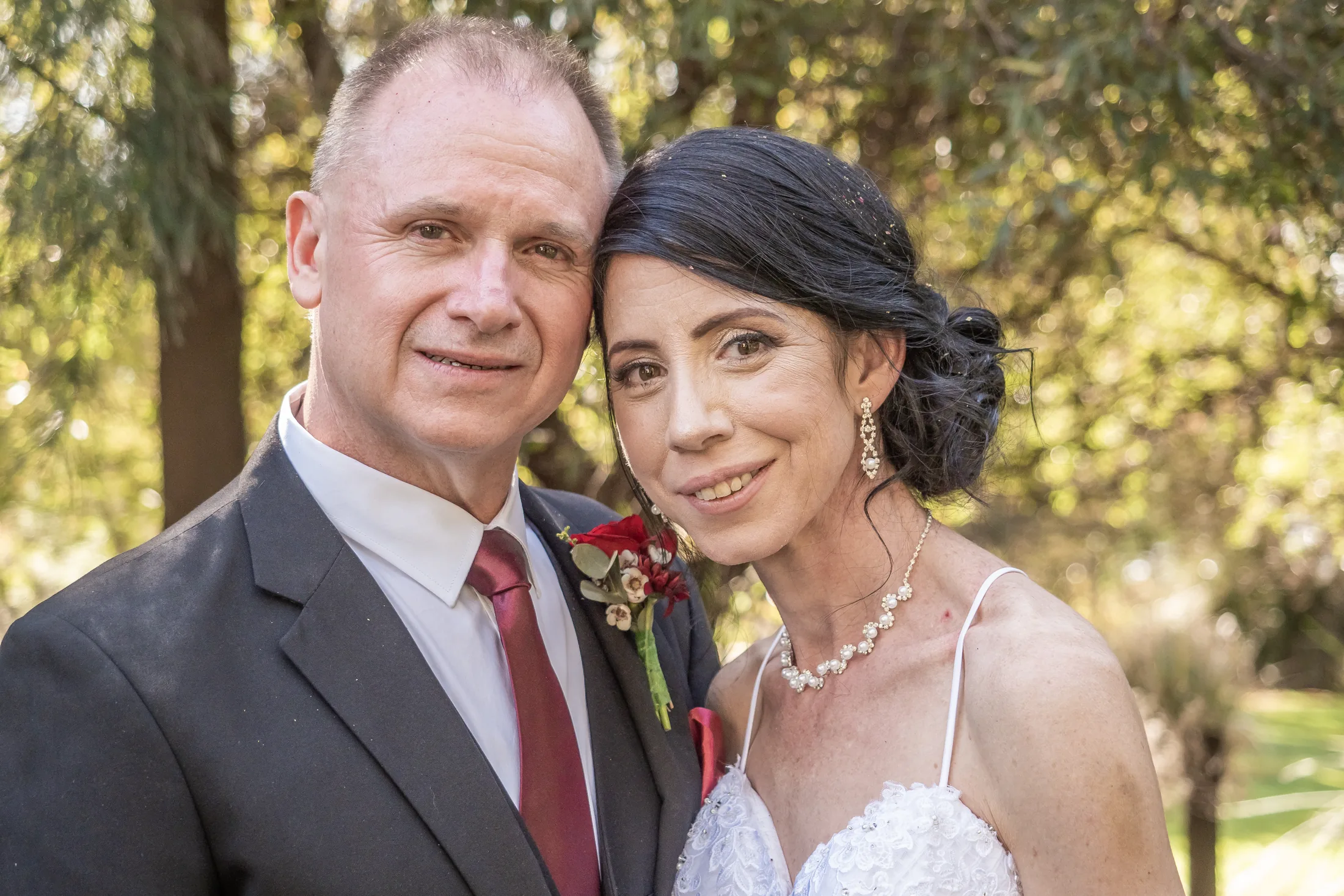 Close portrait of Billy and Karen together among the trees at Lavandou
