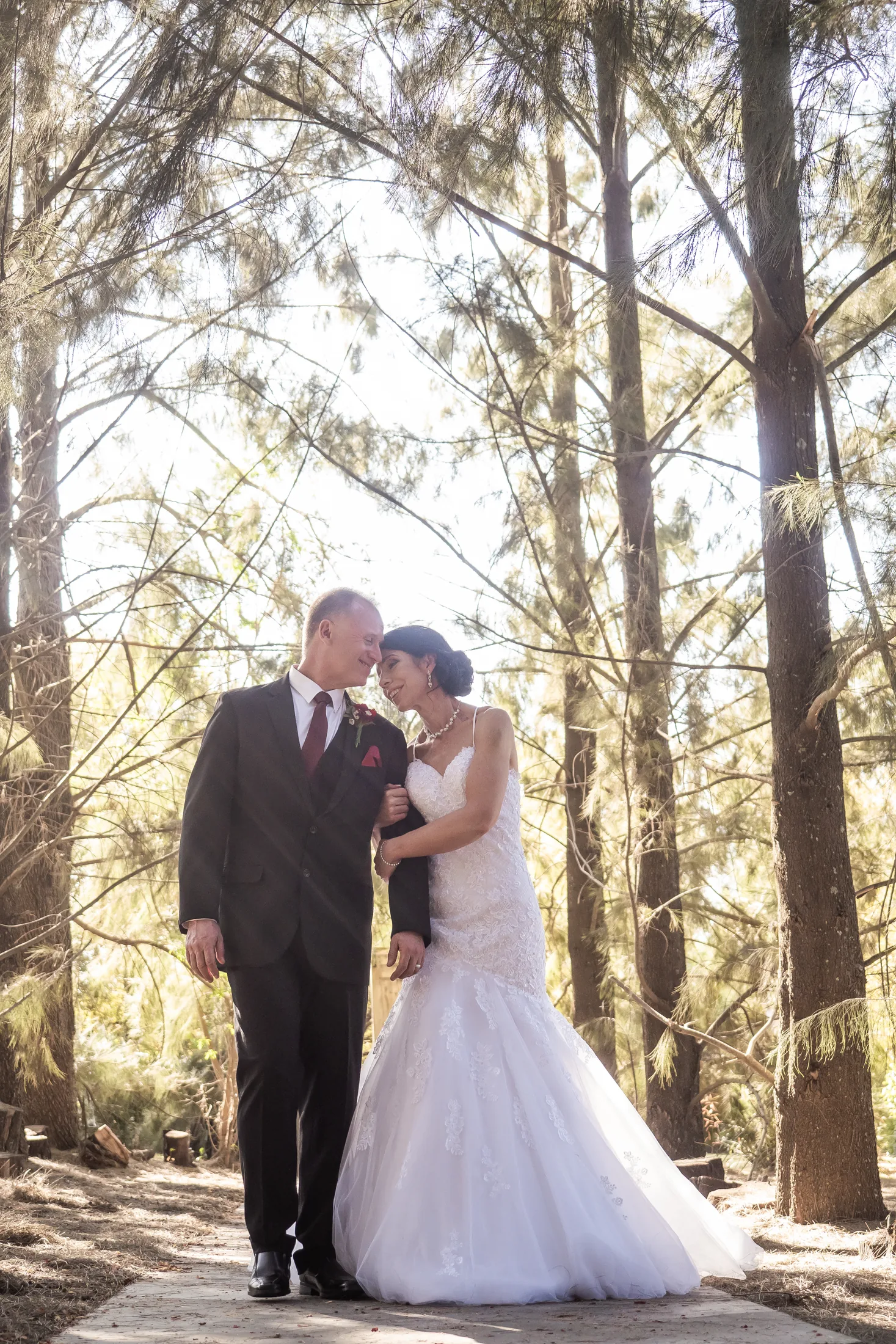 Billy and Karen embracing in the forest