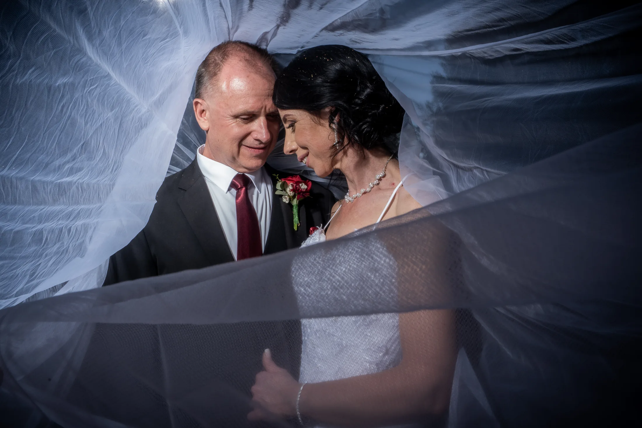 Billy and Karen together beneath Karen’s veil