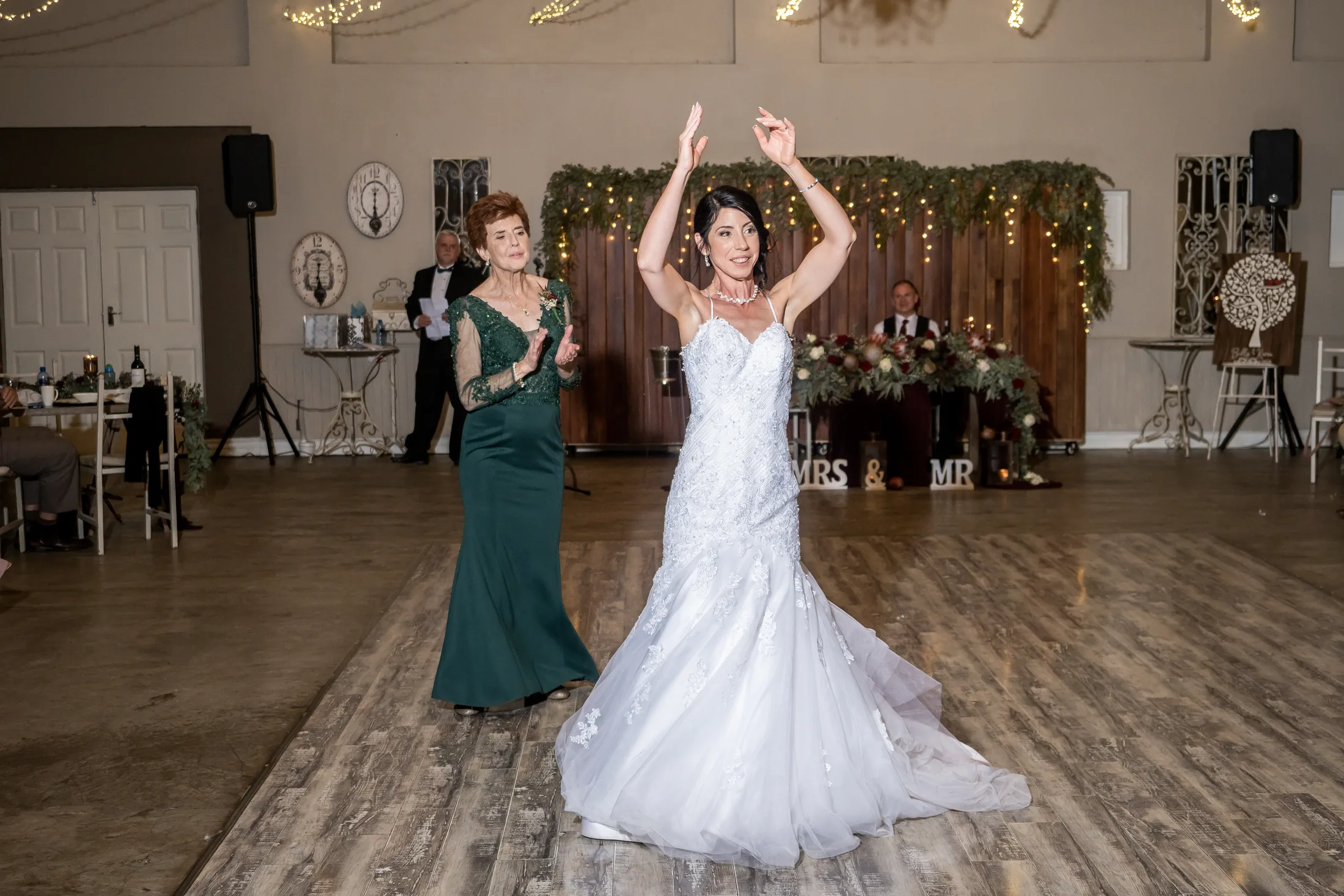 Karen dancing with a guest at the reception