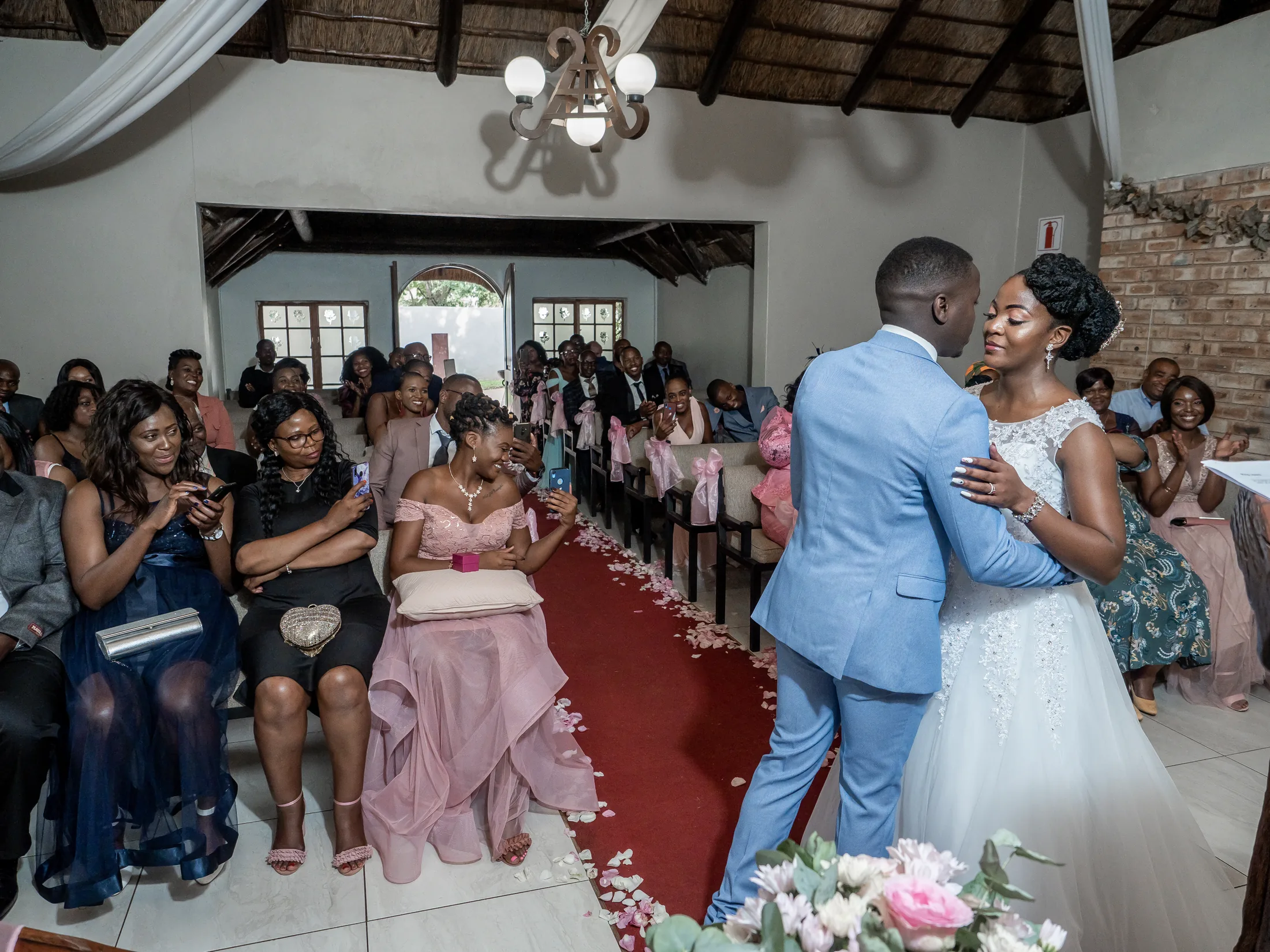 Dumi and Karabo embracing after the ceremony