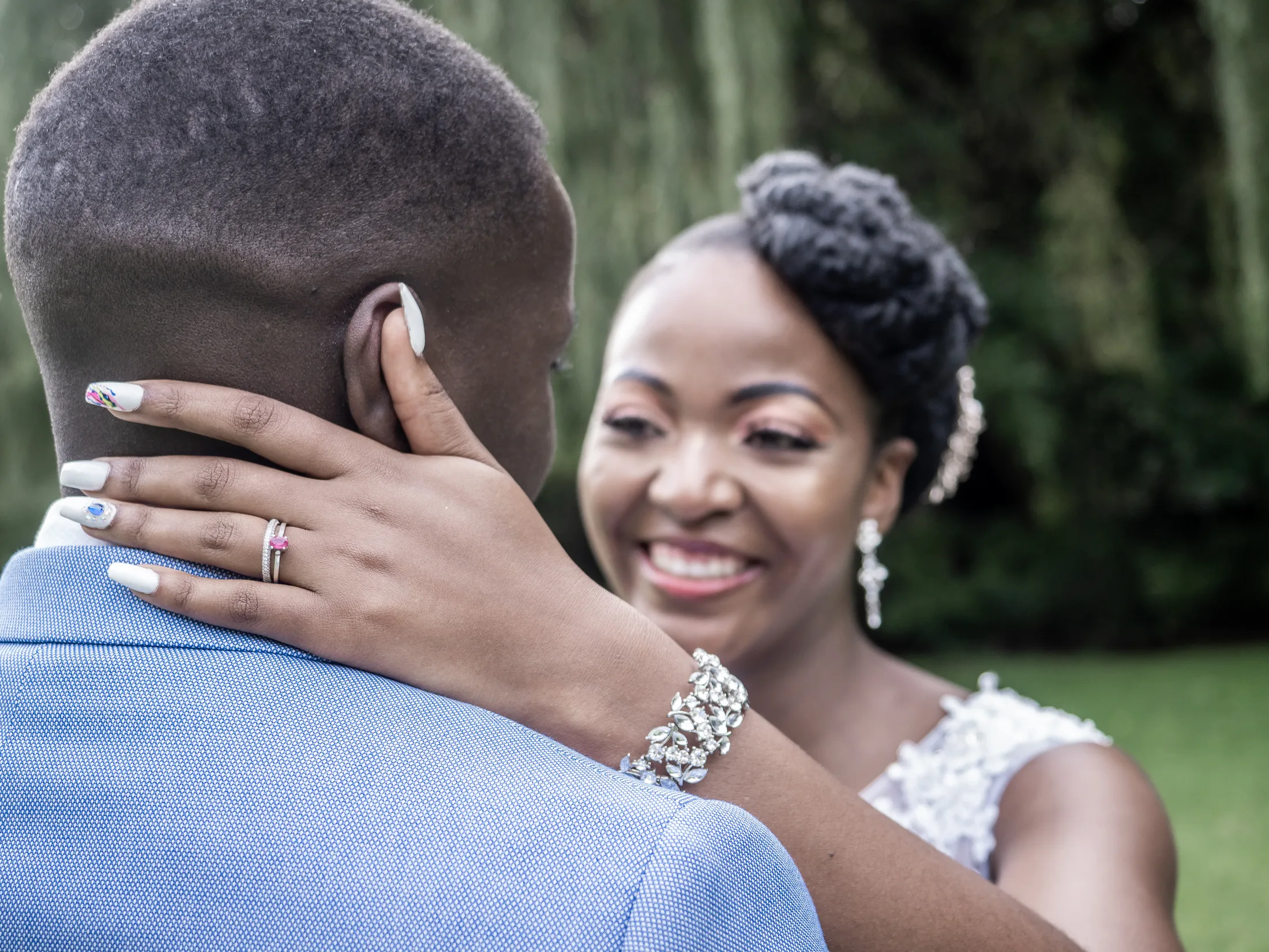 Karabo smiling as she embraces Dumi