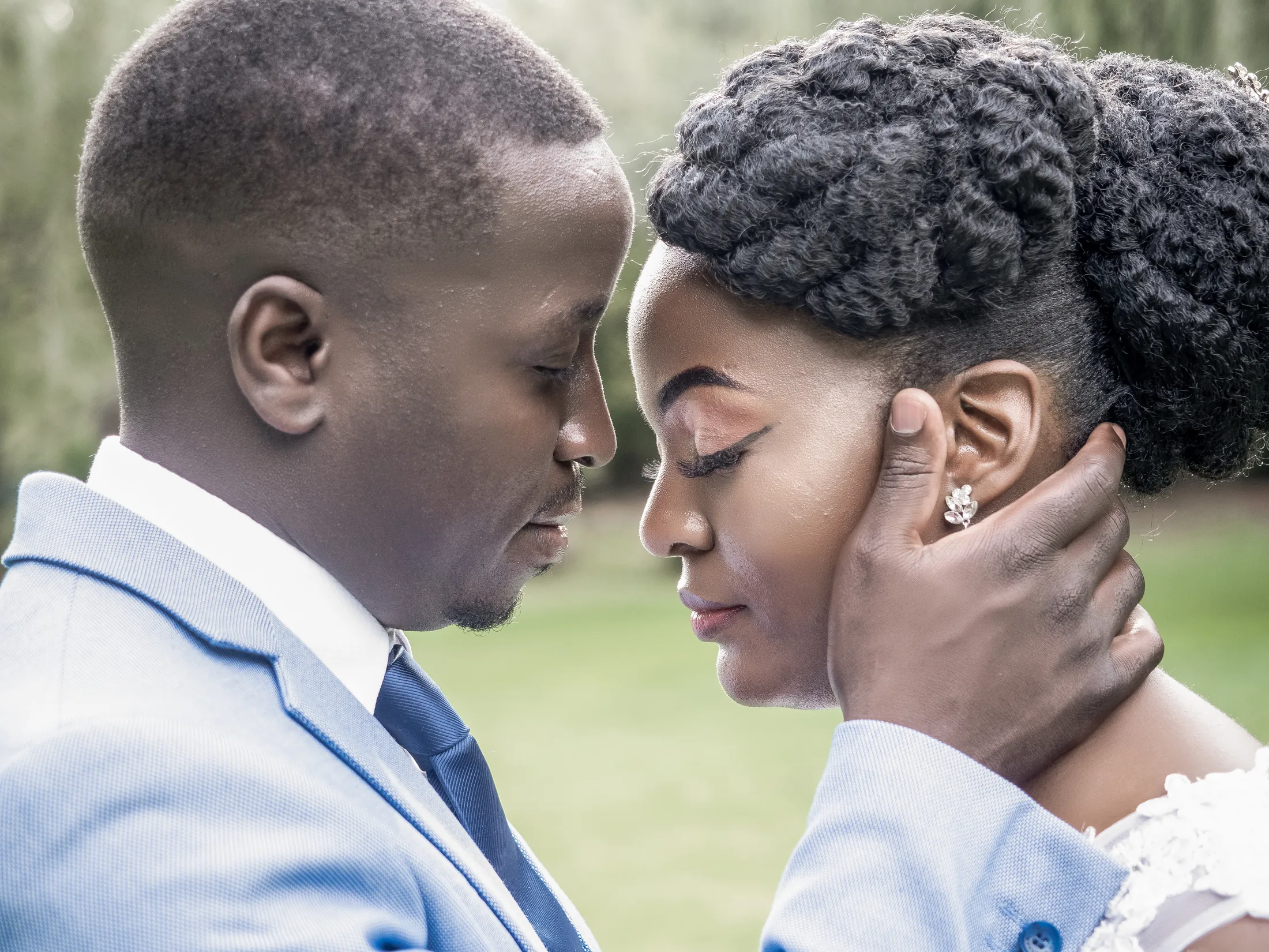 Dumi and Karabo resting their foreheads together