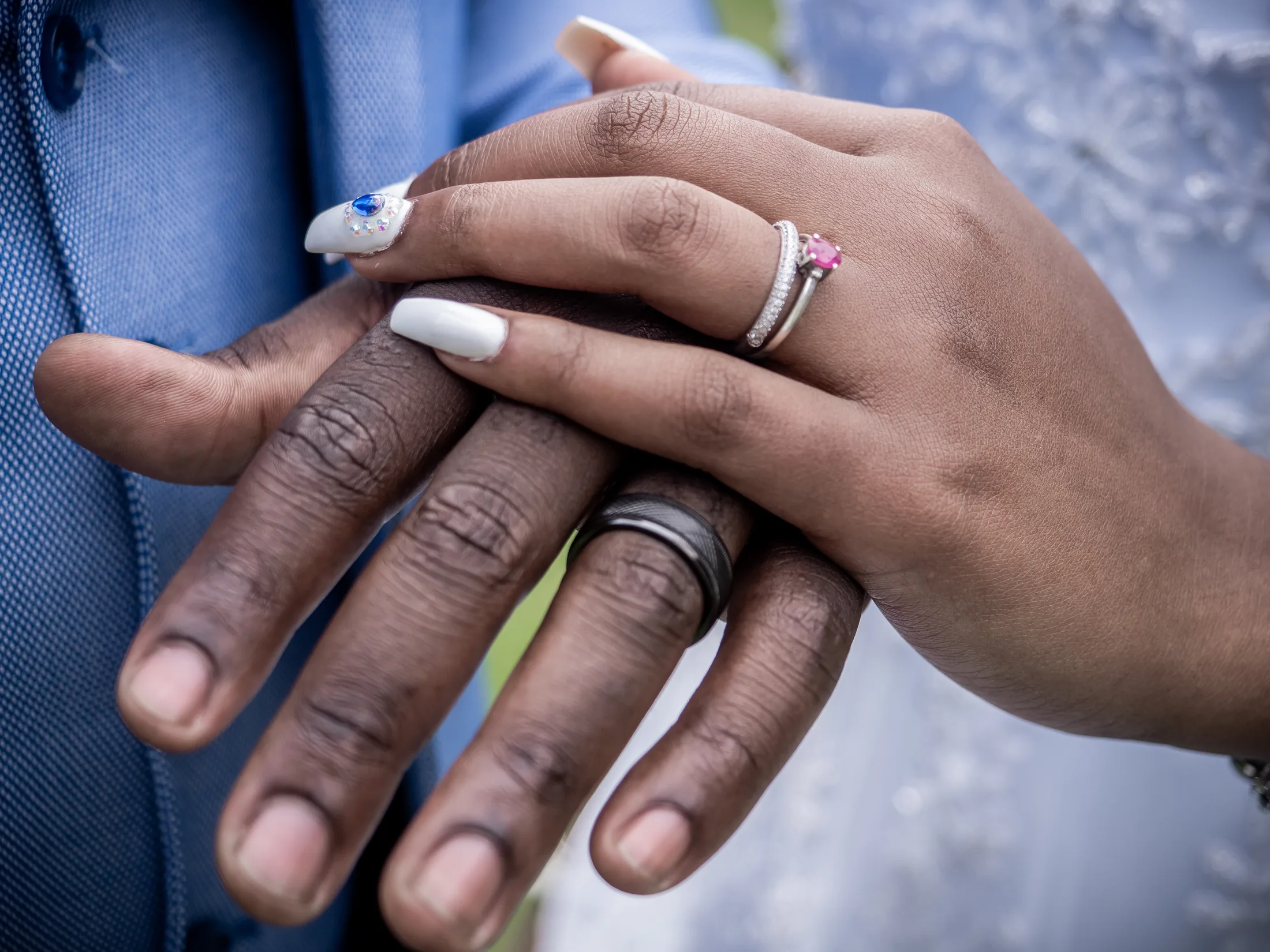 Dumi and Karabo showing their wedding rings