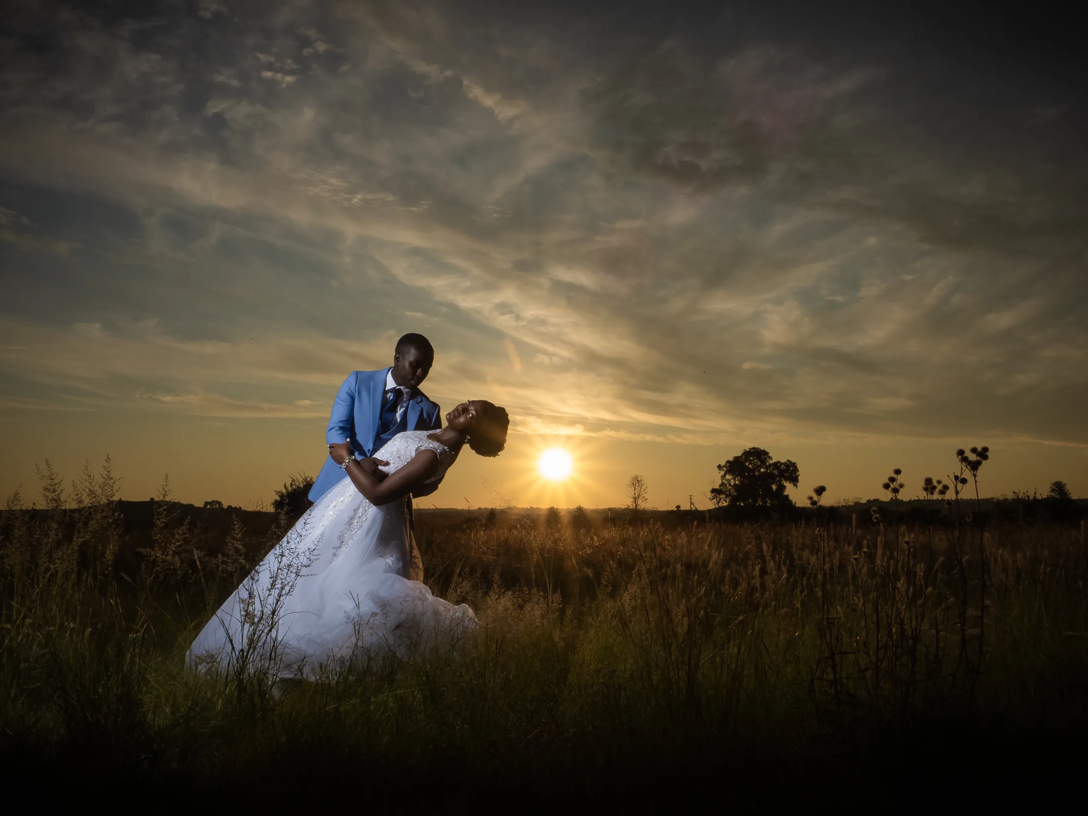 Dumi lifting Karabo at sunset at Makiti Wedding Venue