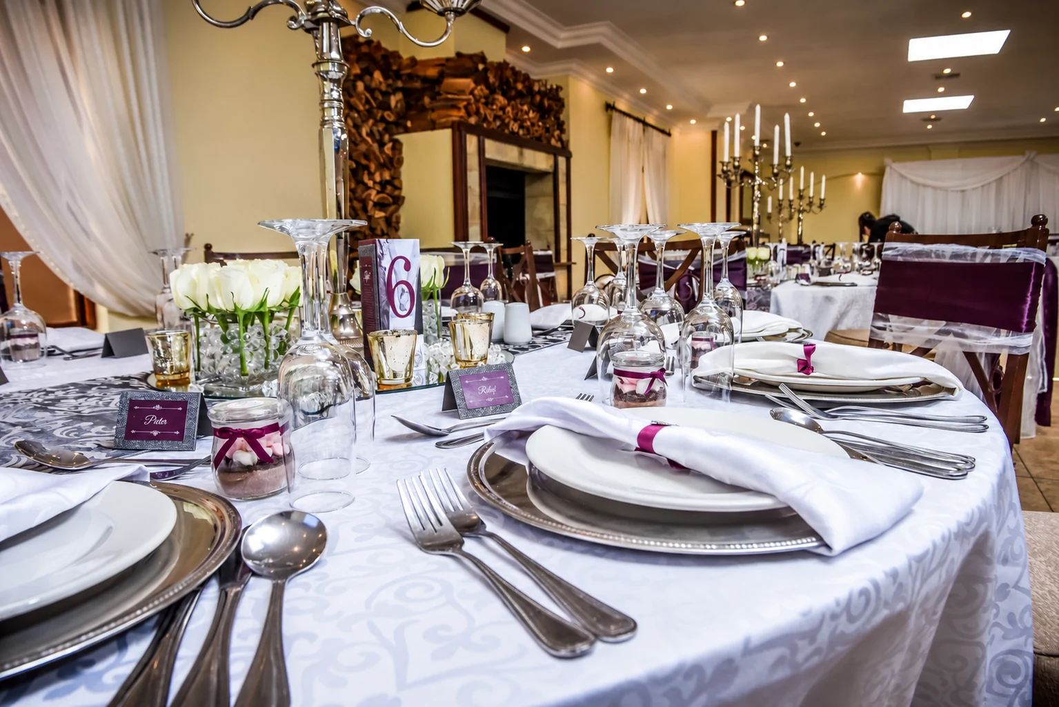 Reception table details with purple accents at Ettienne and Dorme’s wedding