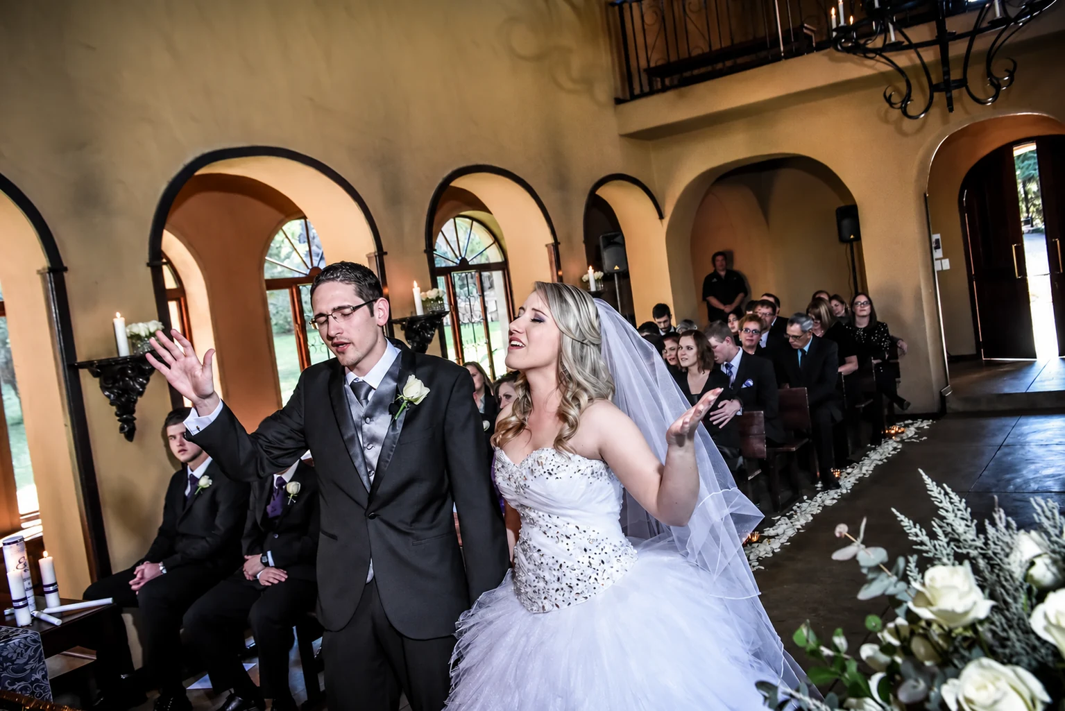 Ettienne and Dorme smiling together during their ceremony