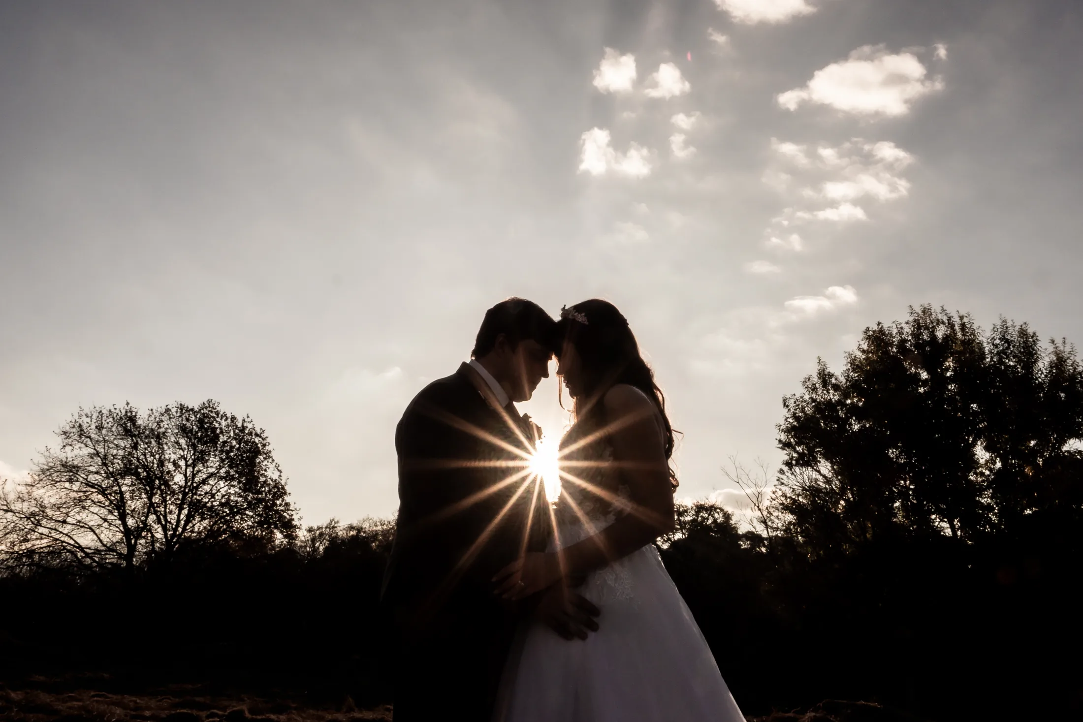 Franco and Anastasia silhouetted in evening light