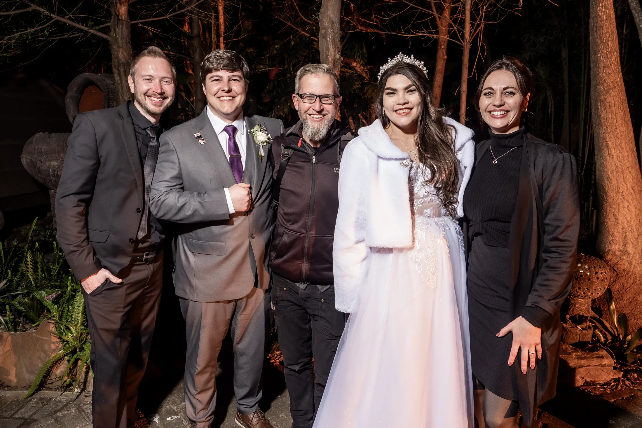 Franco and Anastasia with loved ones outside at night