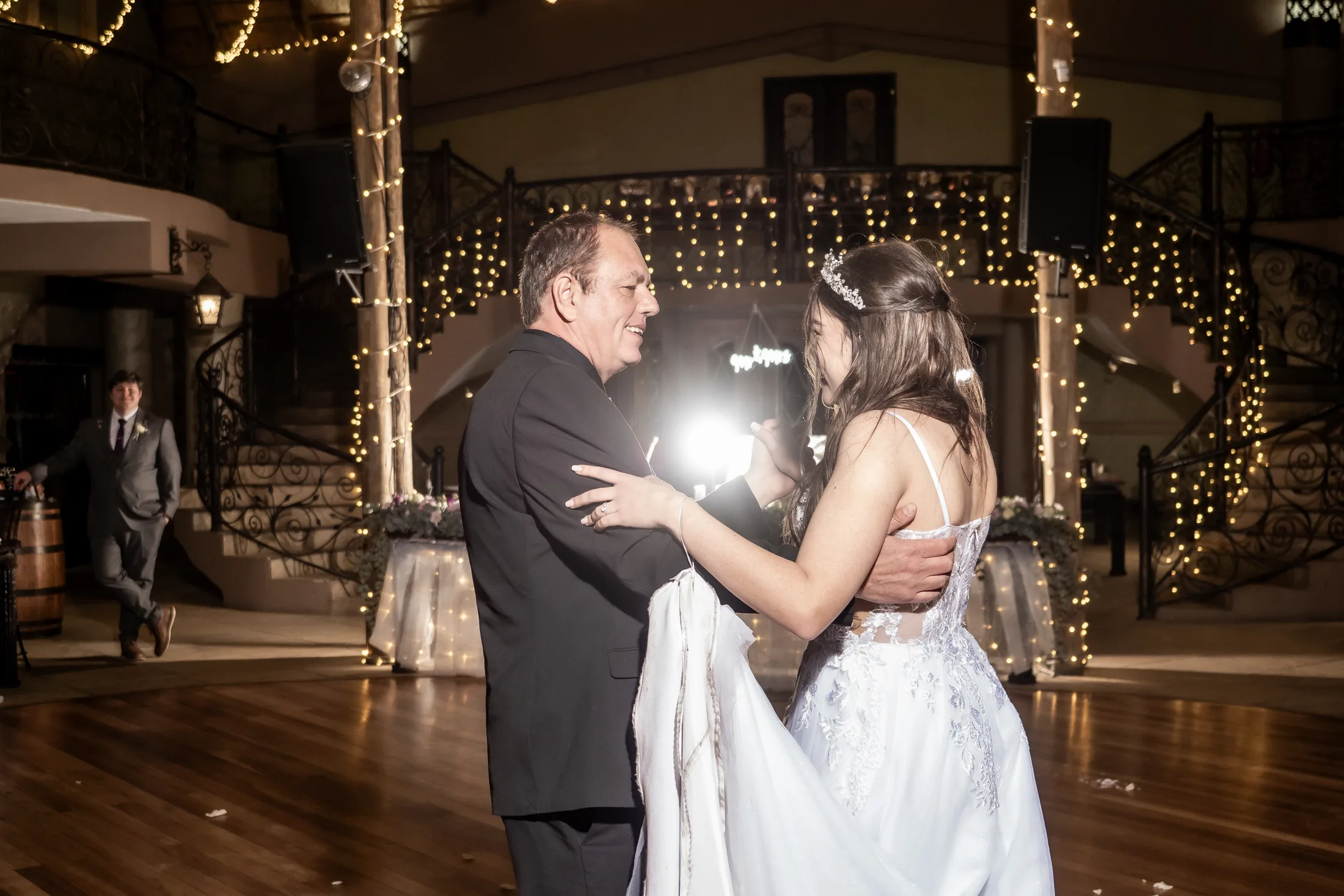 Anastasia dancing with a loved one at the reception