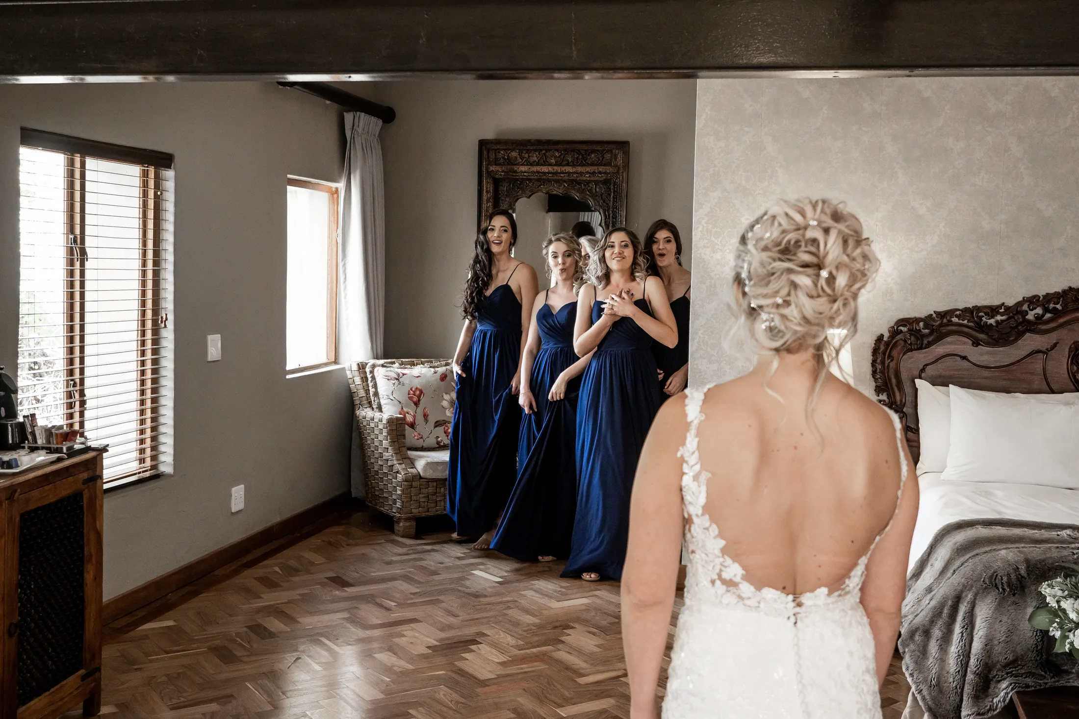 Leani with her bridesmaids in navy dresses