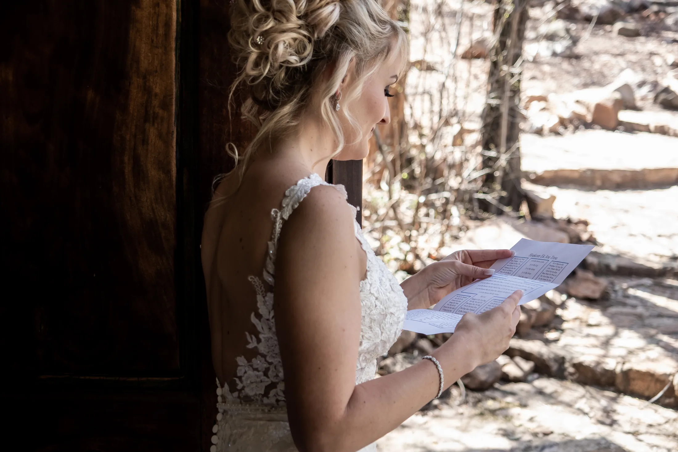 Leani reading a note before the ceremony