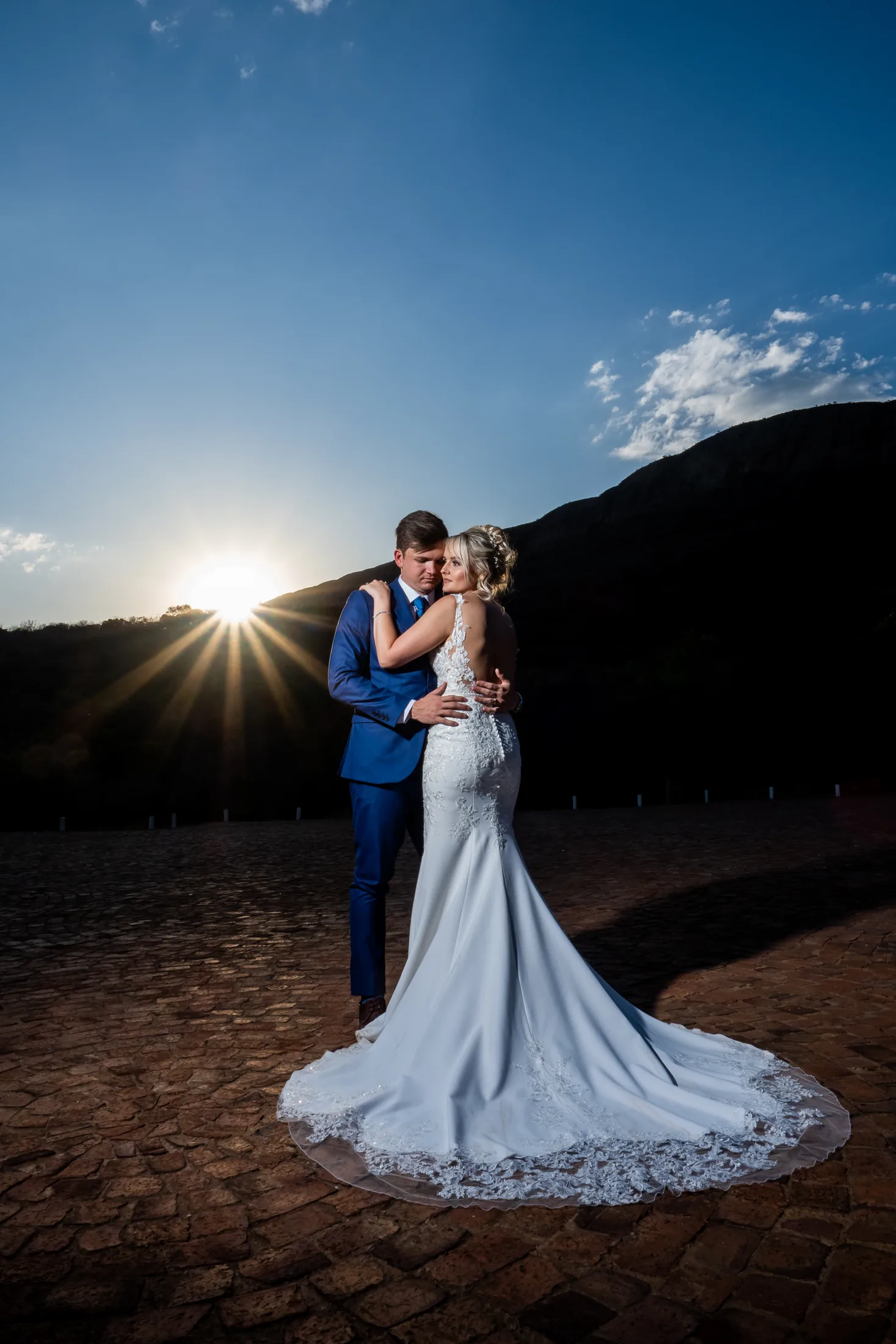 Xander and Leani together against the blue evening sky