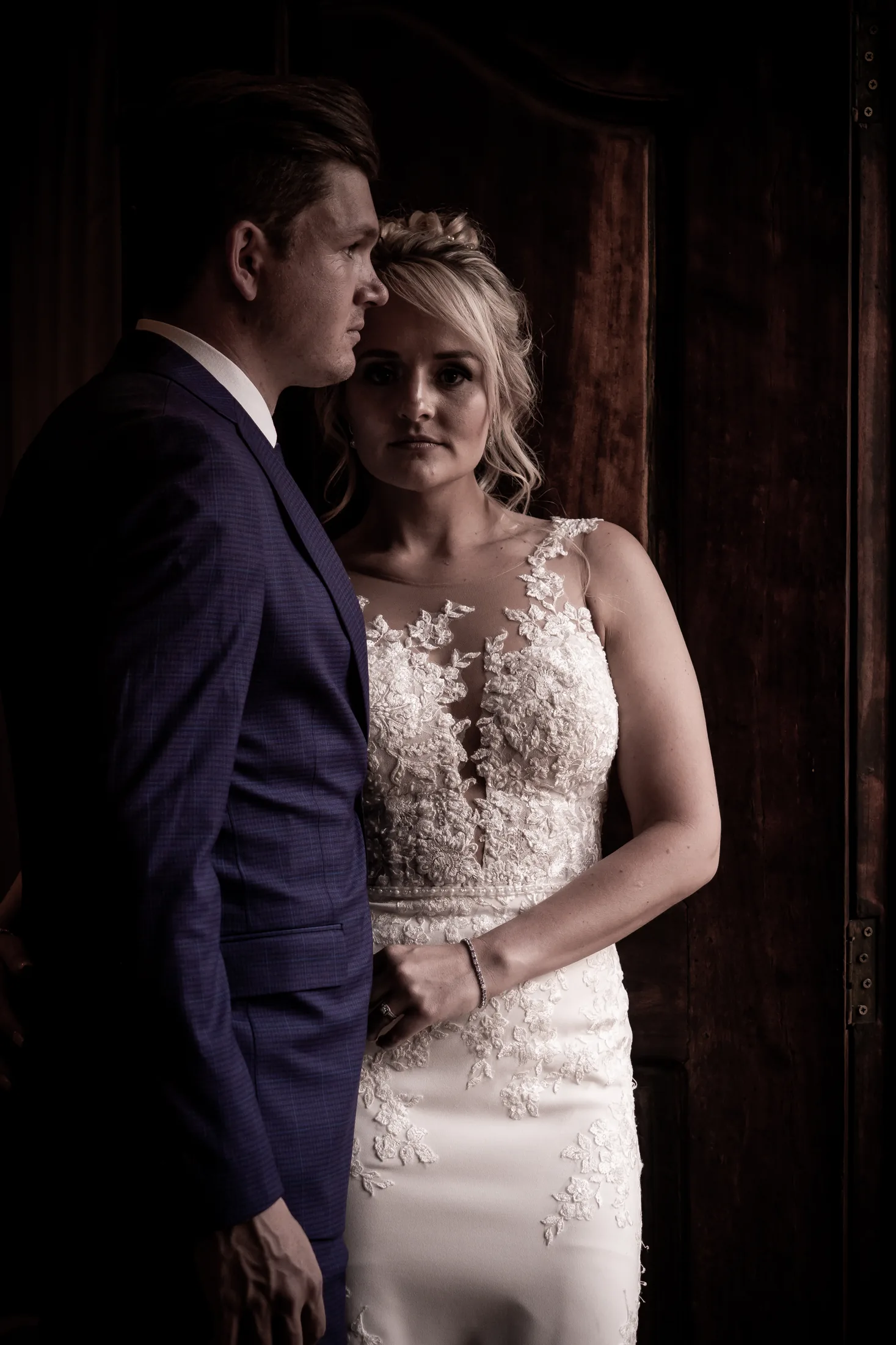 Xander and Leani together in a warmly lit doorway