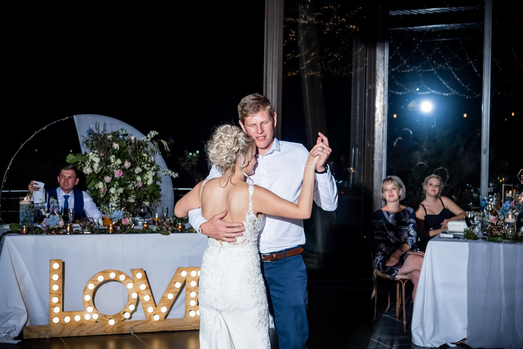 Leani dancing with a family member at the reception